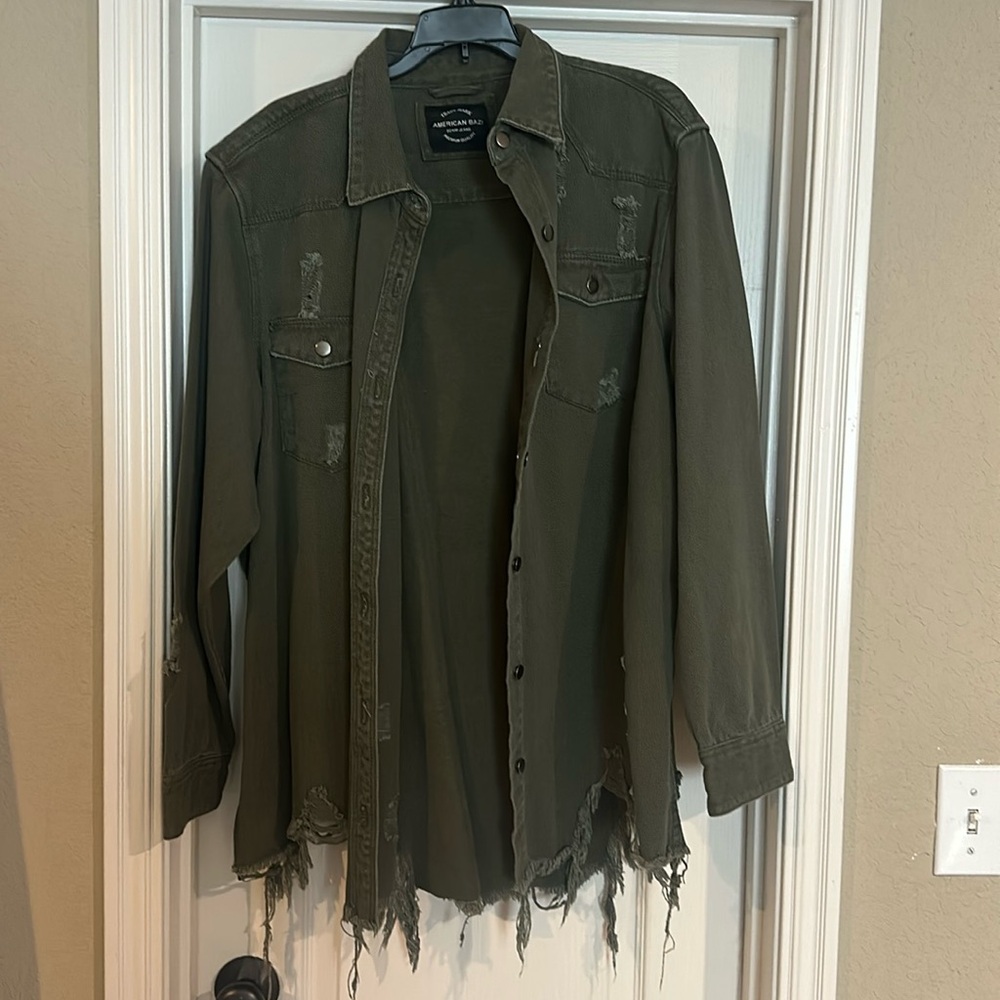 Distressed army green denim jacket.